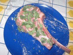 veal chop covered with coarsely chopped sage leaves