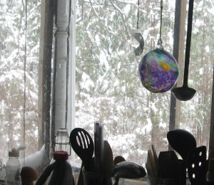 snow covered trees and glass ornament